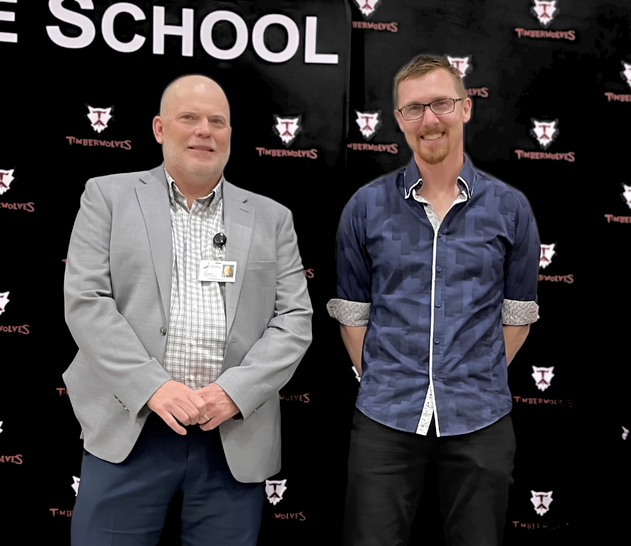 PRSD Superintendent congratulates a teacher on long-service recognition